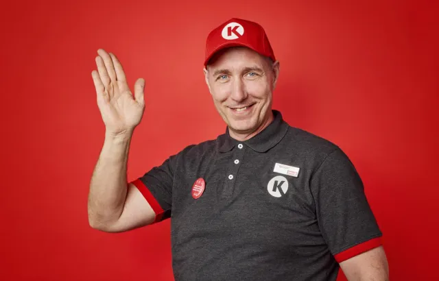 CK DK Store guy waving